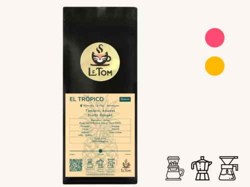 Le Tom Café El Trópico reserve coffee in black packaging with pale yellow label showcasing Honduran coffee from Marcala, La Paz. Label displays flavor notes of tamarind, pineapple, and red fruits. Features organic certification, 1400-1540m altitude, produced by Bryan Adolfo Bautista Zelaya at Finca Adolfo, using Catuai variety with natural processing method. Medium roast, recommended for cold brew, moka pot, and pour-over brewing.