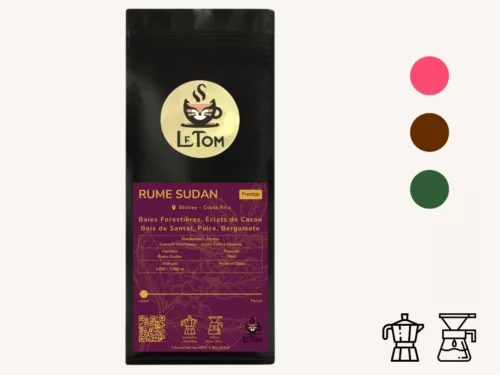Le Tom Café Rume Sudan specialty coffee bag from Costa Rica featuring a black matte package with purple label displaying flavor notes of forest berries, cacao, sandalwood, pear, and bergamot. Label shows altitude 1250-1380m, produced by Gonzalo Hernandez at Jardín Coffee Diversa farm, with Rume Sudan variety and honey processing method. Medium-dark roast, recommended for moka pot, pour-over, and filter brewing methods. Features Prestige classification and roasted in Montreal.